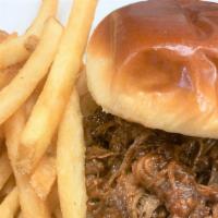 Bbq Pulled Pork Sandwich · Slow roasted pork loin tossed in our homemade whiskey barbeque sauce on a brioche roll.