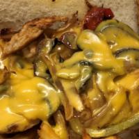 Philly Chicken Cheese Steak Sandwich · Grilled chicken breast, sautéed onions, mushrooms, bell peppers and American cheese on a lon...