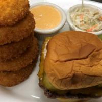 The American Stack Burger · NEW! Topped with pickle chips, American cheese on a soft potato roll served Texas petal sauc...