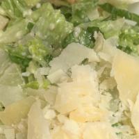 Caesar Salad · Chopped hearts of romaine, croutons, shaved Parmesan cheese tossed with our Caesar dressing.