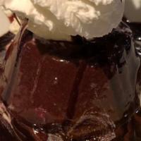 Chocolate Lava Cake · chocolate cake filled with chocolate ganache served warm with vanilla bean ice cream.