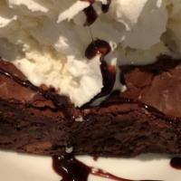 Homemade Brownie Freakout · A warm homemade brownie topped with vanilla bean ice cream, chocolate syrup and whipped cream.