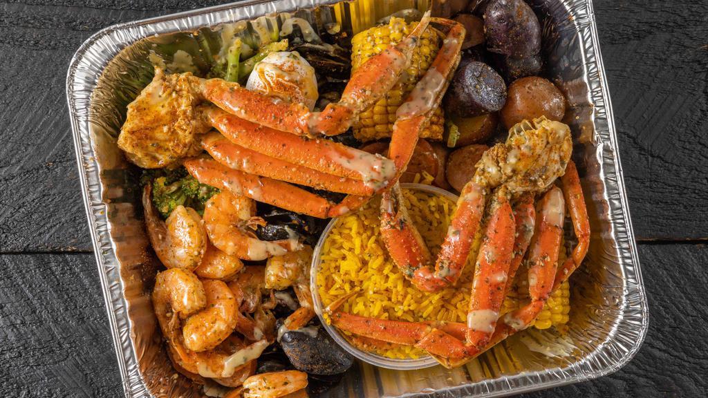 Garlic Butter Seafood Boil · Includes one cluster of snow crab legs (substitute: Dungeness for an additional charge), corn, potatoes, one boiled egg and sausage.