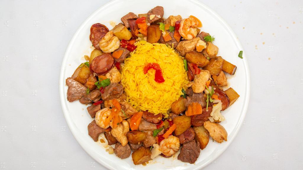 Portugalo Picadinho · Cubed pork, potato, beef, Portuguese sausage and shrimp sauteed with white wine and garlic served with rice.