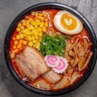 Spicy Miso Ramen · Made with chicken and beef broth. Topped with braised pork belly, scallions, fishcake, bambo...