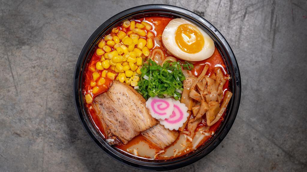 Spicy Miso Ramen · Made with chicken and beef broth. Topped with braised pork belly, scallions, fishcake, bamboo, and corn. Egg ramen noodles.