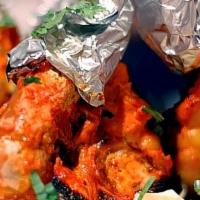 Tandoori Shrimp · Shrimps marinated with herbs and mild spices, fire grilled.