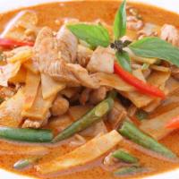 Red Curry - Spicy · Coconut milk with eggplant, peppers, onions, bamboo shoots, lime leaves and basil leaves.