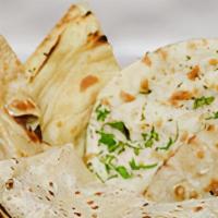 Bread Basket · An assortment from the Indian clay oven of naan, cheese naan, lachha paratha, tandoori roti.