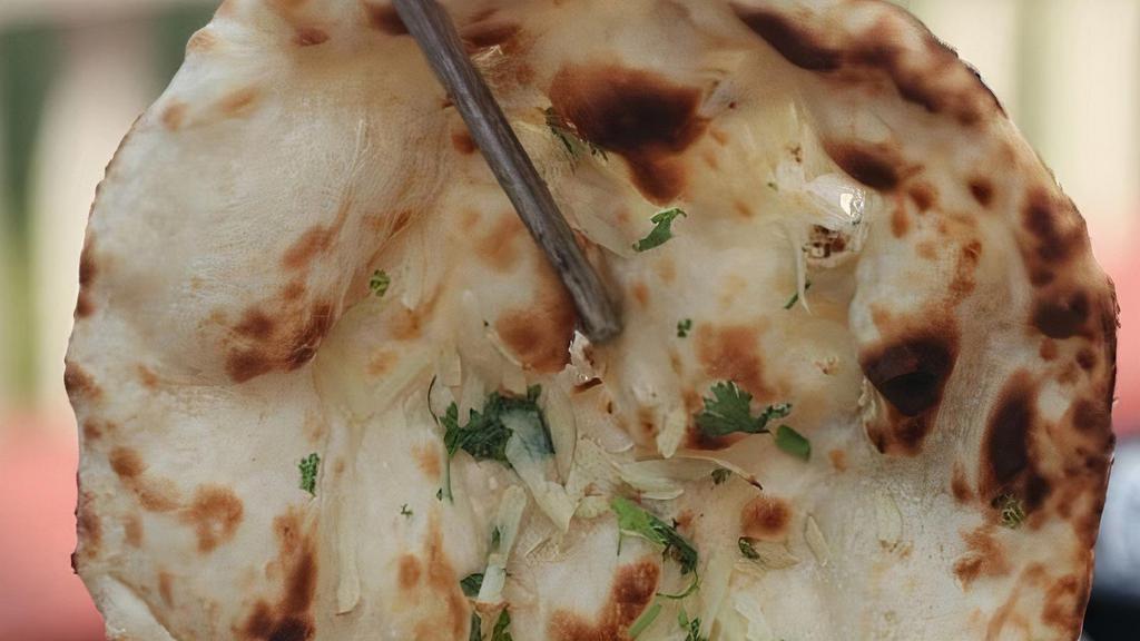 Nan · Traditional white bread, baked in the tandoor, with or without butter.