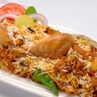 Chicken Biryani · Boneless chicken with fragrant basmati rice, whole spice & yogurt sauce.
