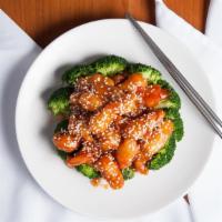 Sesame Chicken · Spicy. Chicken specially prepared and blended with a mouth-watering brown sauce, covered wit...