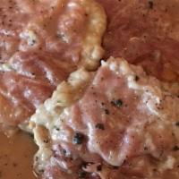 Saltimbocca Alla Romana · Veal scaloppini topped with sliced prosciutto served on a bed of spinach and sautéed in whit...