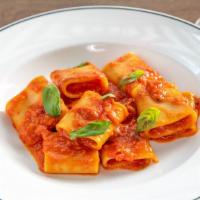 Paccheri Al Pomodoro · Al dente paccheri, San Marzano tomato sauce, basil, Parmigiano Reggiano