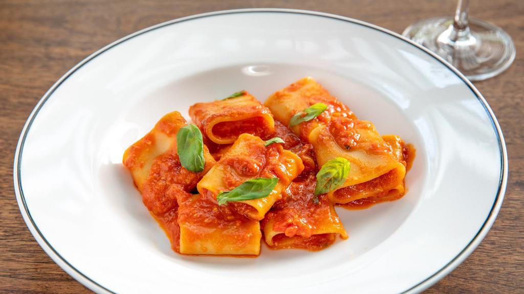 Paccheri Al Pomodoro · Al dente paccheri, San Marzano tomato sauce, basil, Parmigiano Reggiano
