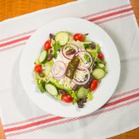 Greek Salad · Lettuce, tomato, onion, cucumbers, black olives, feta cheese, and our home made greek dressing