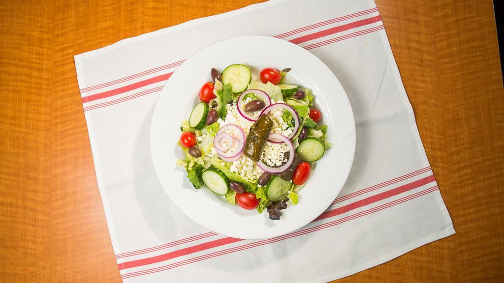 Greek Salad · Lettuce, tomato, onion, cucumbers, black olives, feta cheese, and our home made greek dressing