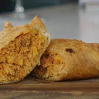 Empanada De Pollo. · Pastry turnover  filled with chicken or ground  beef.