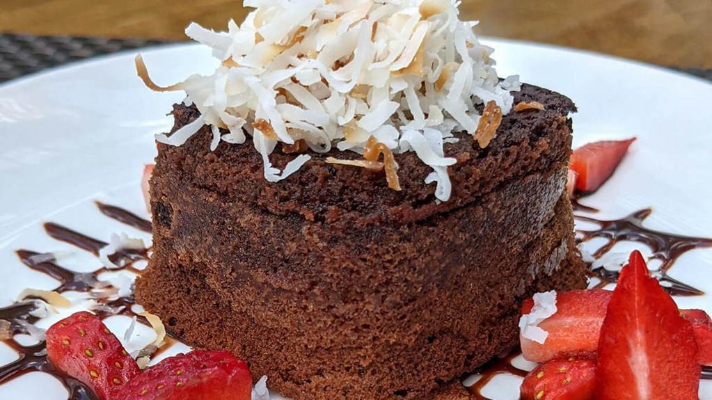 Chocolate-Coconut Lava Cake. · strawberry coulis, toasted coconut