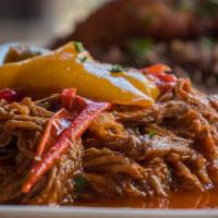 Ropa Vieja For 4. · Shredded flank steak simmered in peppers, onions & tomato (32 ounces). Includes Mixed Greens...