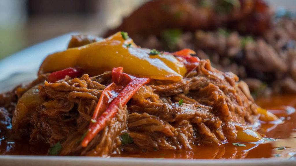 Ropa Vieja For 4. · Shredded flank steak simmered in peppers, onions & tomato (32 ounces). Includes Mixed Greens Salad and choice of 4 Sides.