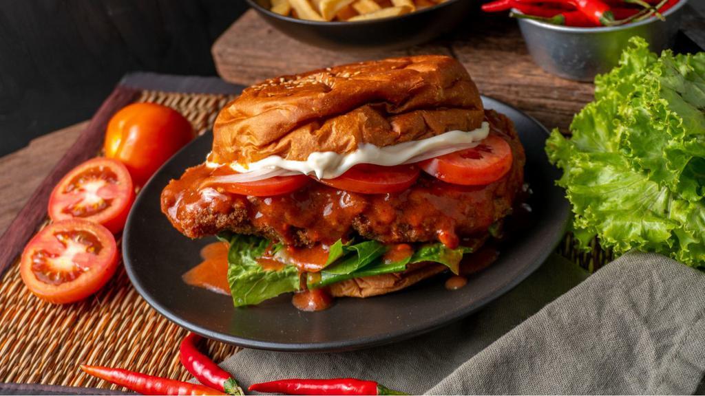 Bacon Buffalo Chicken Tenders Sandwich · Buttermilk fried chicken tenders dipped in buffalo sauce and crispy bacon with your choice of condiments, served on a lightly toasted bun.