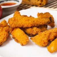 Buffalo Chicken Tenders · Fresh hand-breaded, golden-fried chicken tenders dipped in spicy buffalo sauce.