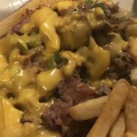 Open Philly Steak · With American cheese, fried onions and grilled peppers on a hero served with french fries.