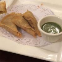 Curry Samosas · Homemade vegetable pasties with mint chutney dip.