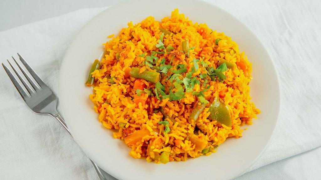 Vegetable Biryani · Spiced mixed vegetable and nuts cooked in rice.