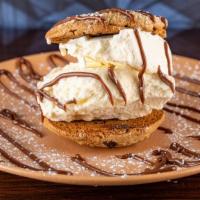 The Mad Cookie · Chocolate chip cookie sandwich - fabulous vanilla ice cream - Belgian milk chocolate sauce.