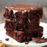 Brownie · Large delicious brownie, filled with chocolate chips and cooked in a deep dish pan.