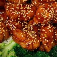 Sesame Chicken · Chunks of tender chicken lightly fried with chef's special sesame sauce. Served with white r...