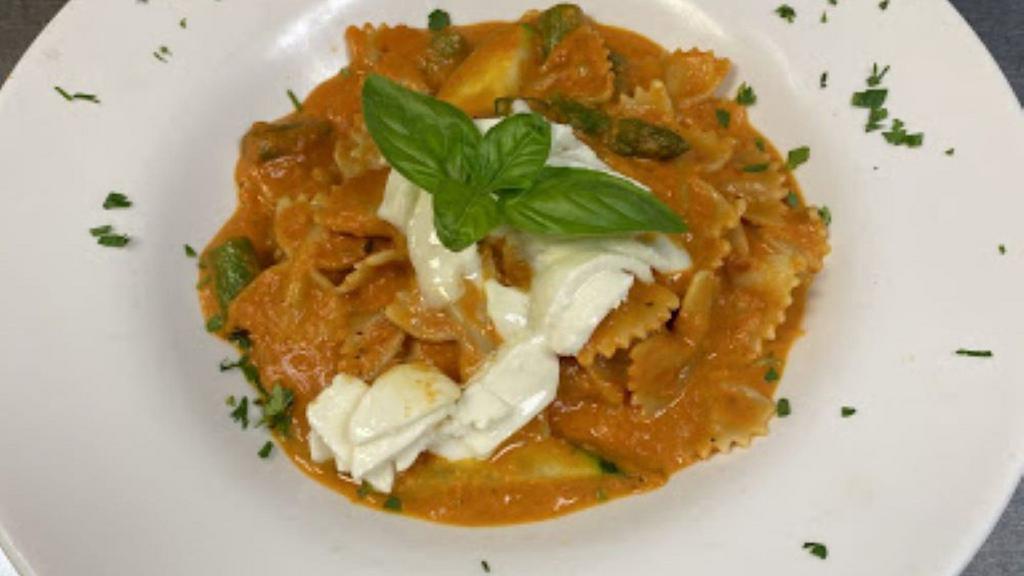 Farfalle With Pepper Vodka Sauce (Spicy Or Mild)  · Bowtie pasta in a cream sauce with a touch of tomato, zucchini, asparagus, and melted mozzarella cheese.