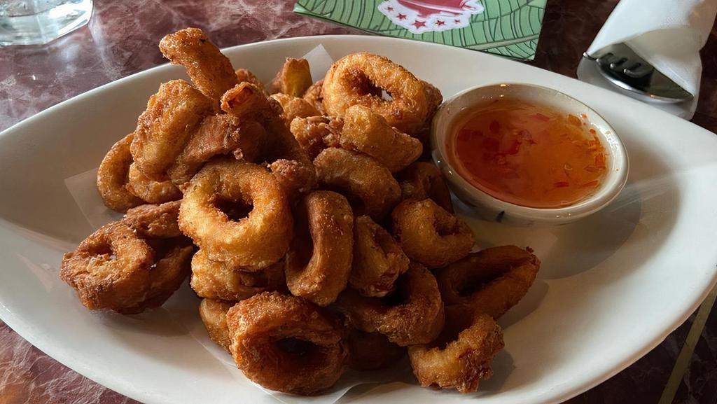 Asian Spice Dusted Calamari · Sweet and sour chili garlic dipping sauce.