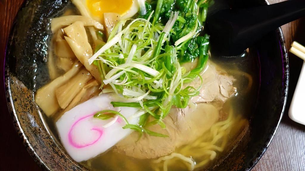 Shoyu Ramen Soup · Soy sauce-based noodle soup with bamboo shoots, boiled egg, roast pork and spinach.
