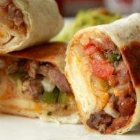Grilled Steak Burrito · Filled with rice, beans, mild salsa, sour cream, mix cheddar, and jack cheese and pico de ga...