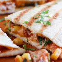 Grilled Chicken Quesadilla · Filled with pico de gallo, mixed cheddar and jack cheese, salsa and sour cream on the side.