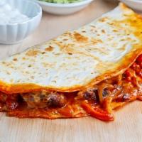 Chicken Fajitas Quesadilla · Filled with pico de gallo, mixed cheddar and jack cheese, salsa and sour cream on the side.