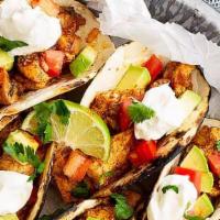 Spicy Chicken Taco · 3 pieces tacos served with onions, and cilantro, reddish, lime, and choice of green or red s...
