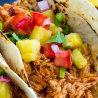 Chicken Taco · 3 pieces tacos served with onions, and cilantro, reddish, lime, and choice of green or red s...