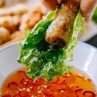 Vegetarian Spring Rolls · Vegetarian spring rolls served with cucumber, pickled carrots and daikon and soy sauce (nuoc...