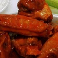 Chicken Wings – 10 Pcs. · cooked crispy, tossed in your favorite sauce and served with celery and our homemade blue ch...