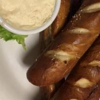 Pub Pretzels · Warm soft pretzels served with a delicious house made beer cheese for dipping