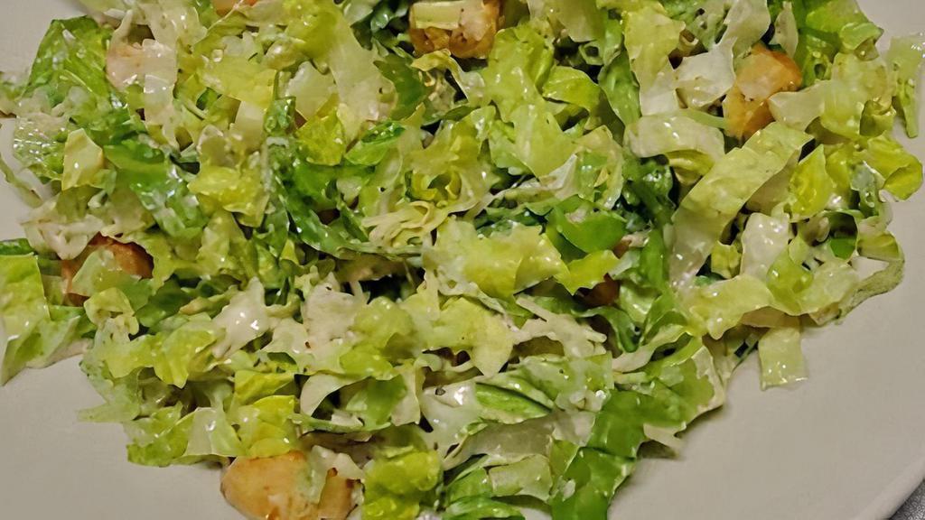 Caesar Salad · hearts of romaine tossed with shredded parmesan, seasoned croutons and caesar dressing