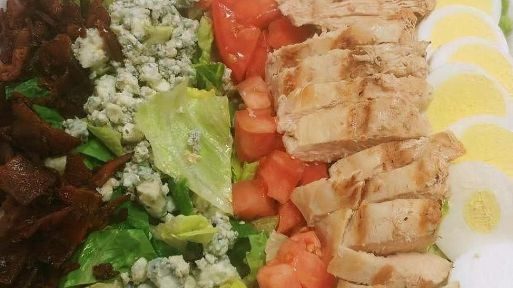 Chicken Cobb Salad · mixed greens with tomatoes, chopped bacon, crumbled bleu cheese, sliced egg and chicken. served with a side of balsamic vinaigrette dressing