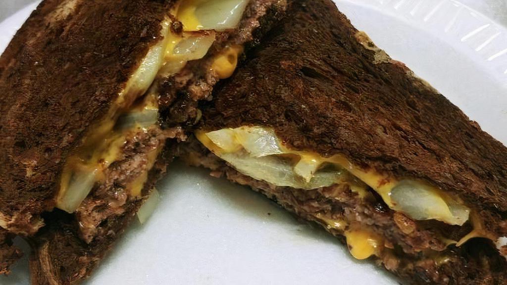 Penfield Special · patty melt style grilled cheeseburger on marble rye with sauteed onions served with choice of side