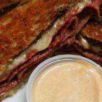 Reuben · on rye with swiss cheese, sauerkraut and your choice of corned beef or turkey. served with a...