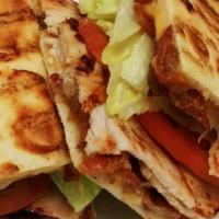 Turkey Panini · fresh roasted turkey, cheddar cheese, bacon, lettuce, tomato and mayonnaise