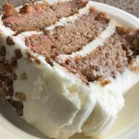Old Fashioned Carrot Cake · moist cake loaded with shredded carrots, pecan pieces and crushed pineapple, covered in a cr...